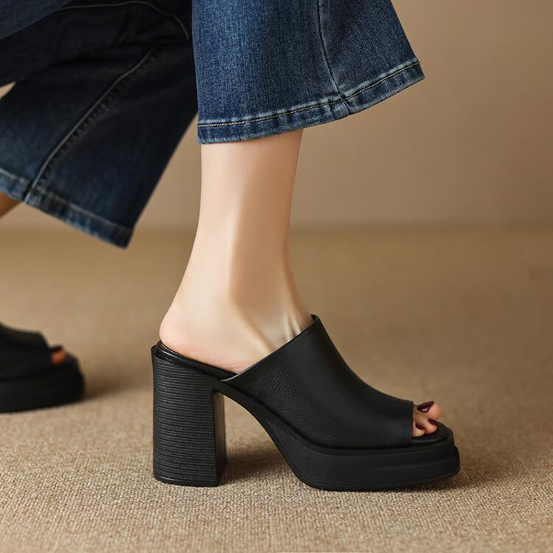 Women's platform flat sandals in neutral tone, sleek silhouette with cushioned sole for effortless lift