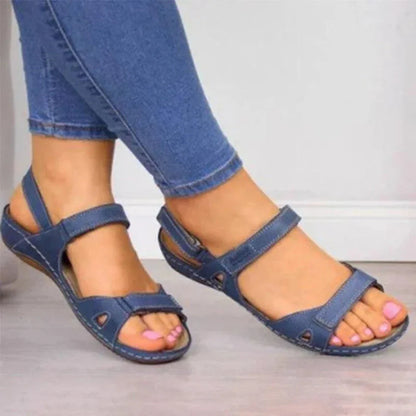 Women's beige comfort open-toe wedge sandals with adjustable Velcro straps and supportive arch footbed