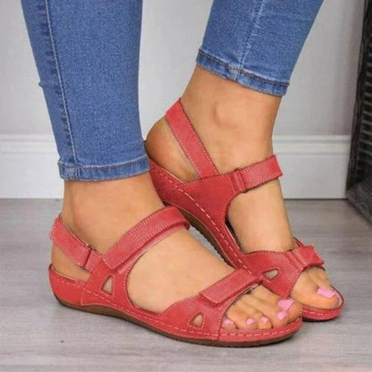 Women's beige open toe comfort wedge sandals with adjustable Velcro straps and supportive arch footbed