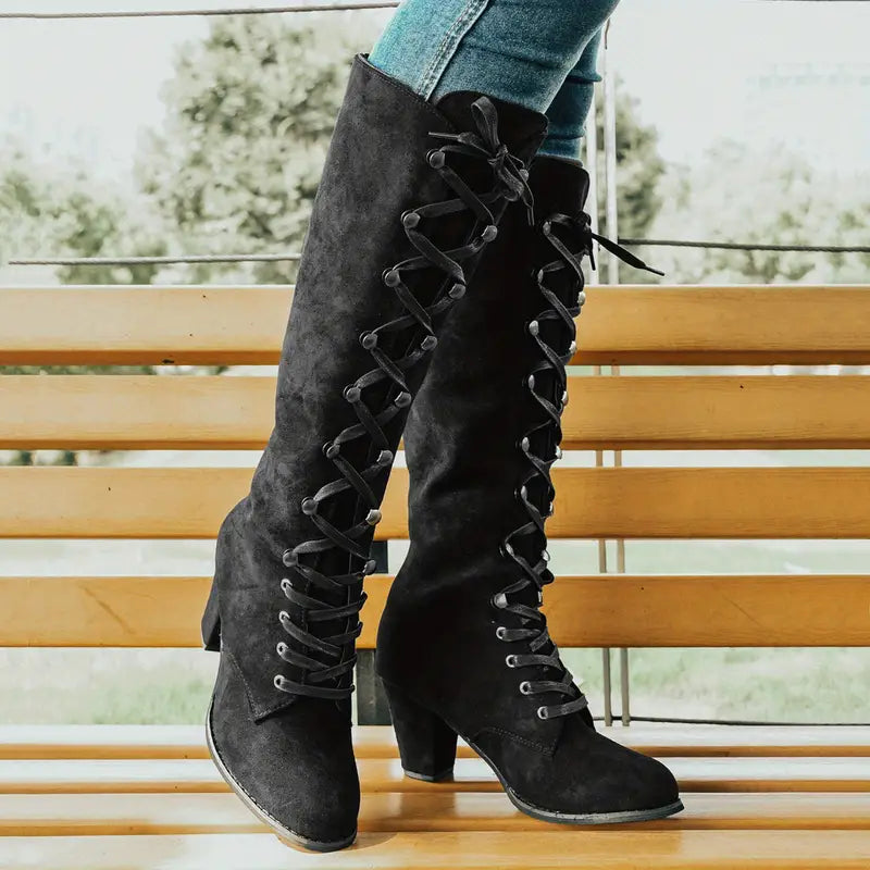 Women's black lace-up block heel long boots with full-length front lacing for bold style