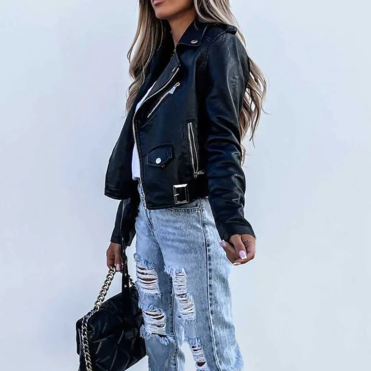 Women's black vegan leather slim-fit biker jacket with asymmetrical zipper and pebble texture belt detail