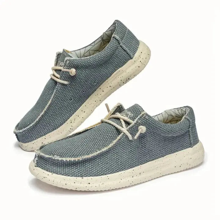 Women's lightweight slip-on shoes in neutral tones, cushioned daily wear style with easy on/off design