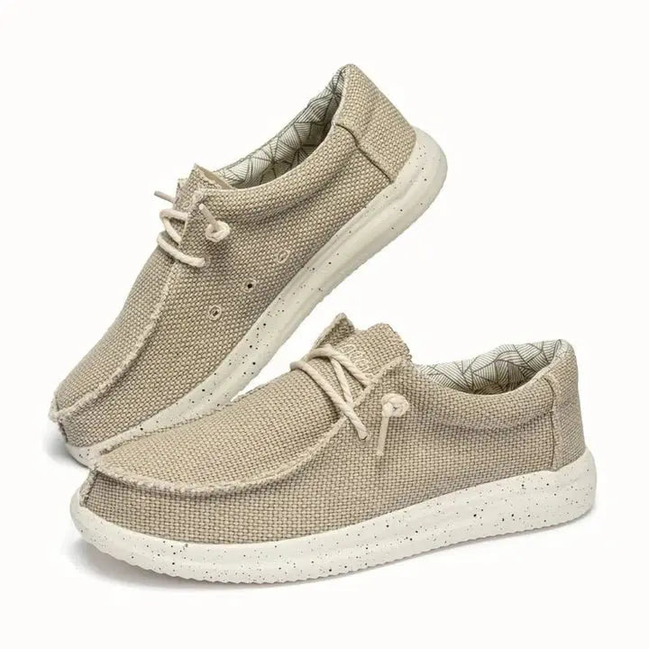 Women's lightweight slip-on shoes in neutral tones, cushioned supportive sole for all-day comfort