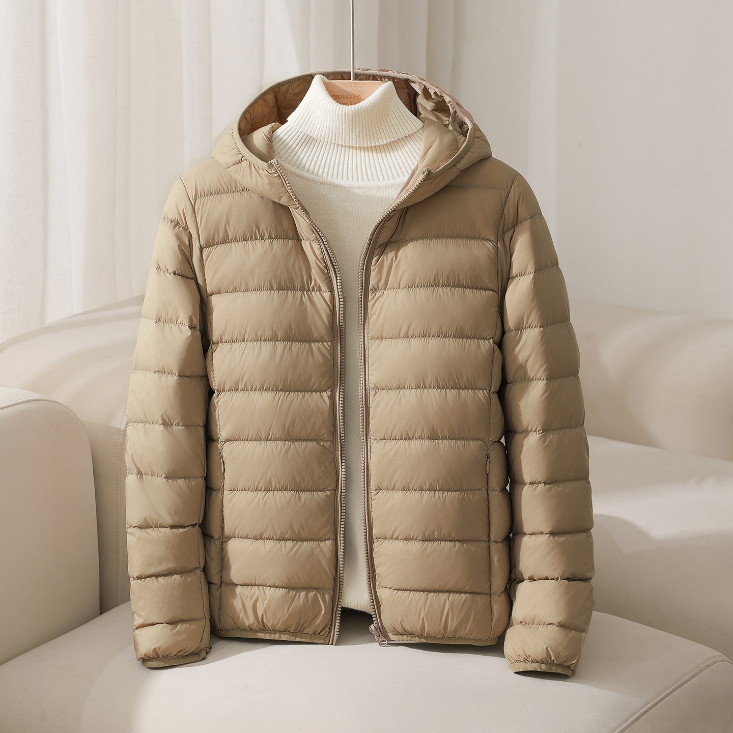 Lightweight hooded quilted down jacket in neutral tone with horizontal stitching slim fit silhouette
