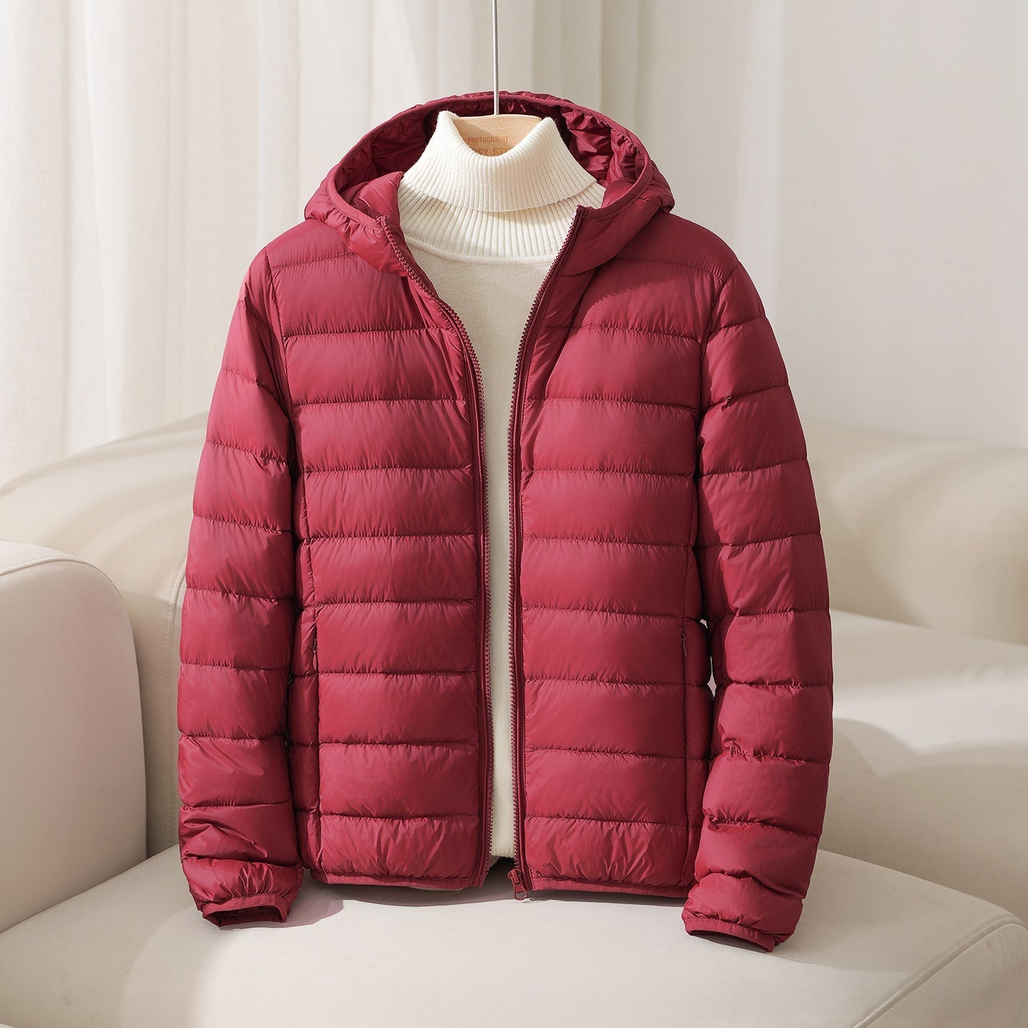 Lightweight hooded quilted down jacket with horizontal stitching, sleek silhouette, nylon shell