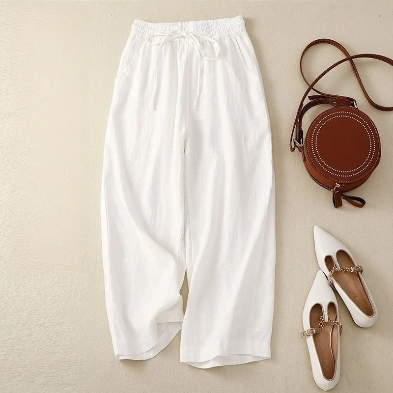 Beige wide-leg linen drawstring pants with relaxed fit and adjustable waistband for effortless style