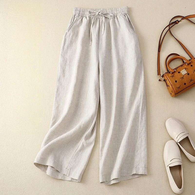 Liora wide-leg linen pants in natural tone with adjustable drawstring waist for relaxed everyday style