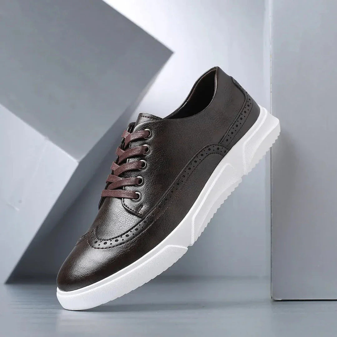 Men's brown faux leather wingtip brogue sneakers with white sole, casual dress style