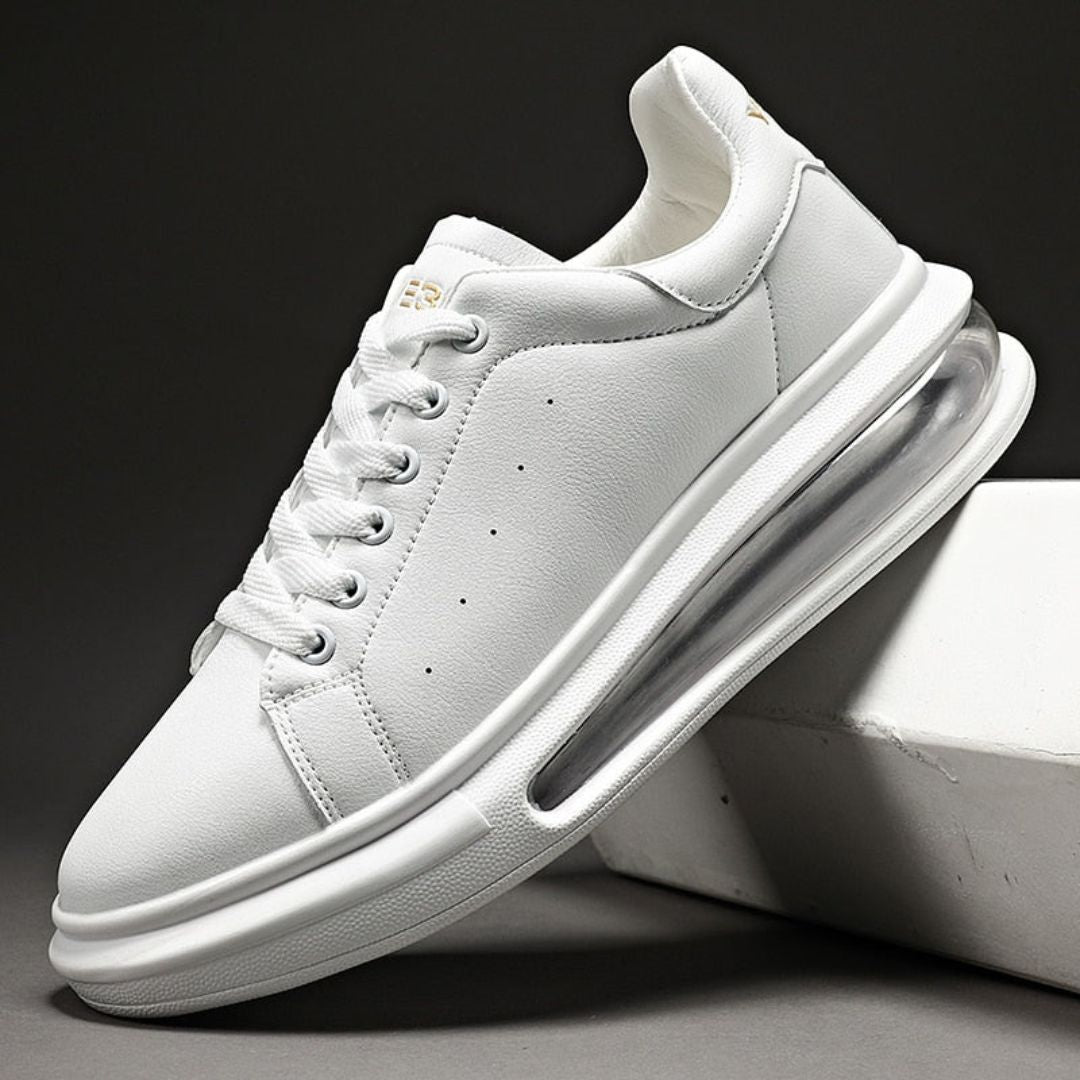 White men's leather platform sneakers with air-cushioned sole and minimalist clean-cut design