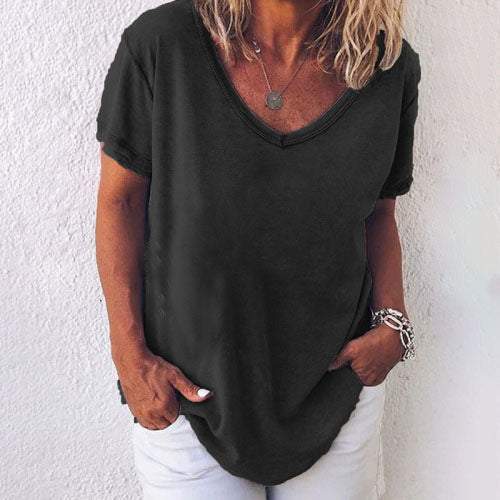 White linen-look relaxed T-shirt with dropped shoulders, side slits, and round neckline