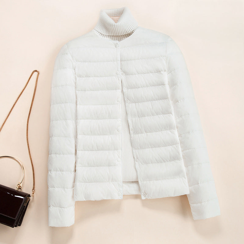 Lumen lightweight quilted down jacket in neutral tone, minimalist round neckline, slim silhouette
