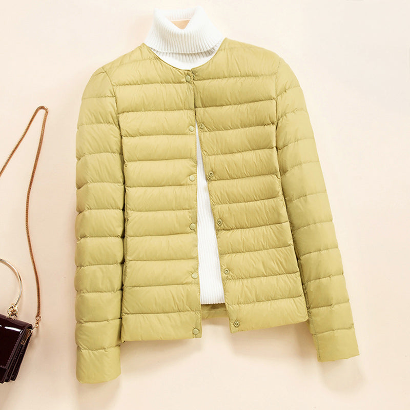 Lumen lightweight quilted down jacket in neutral tone with minimal round neckline and thin insulating quilting