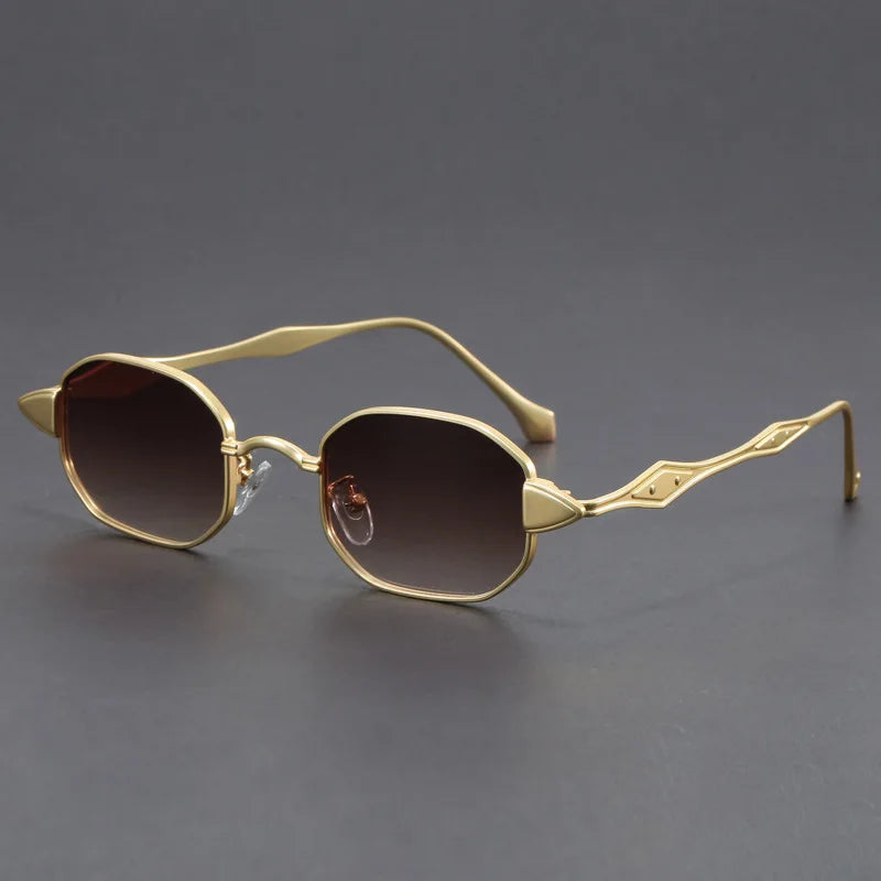 Bold black oval sunglasses with spiked lens corners and sculpted metal arms for avant-garde retro glam