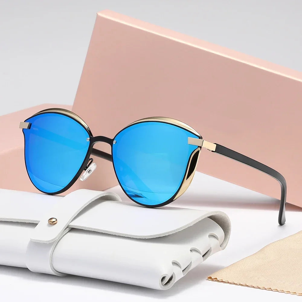 Gold cat-eye sunglasses with metal accents, lightweight luxe frame, and UV400 lens protection