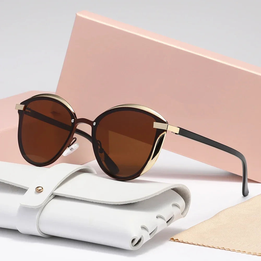 Gold cat-eye sunglasses with metal accents, lightweight luxe finish, and UV400 lens protection