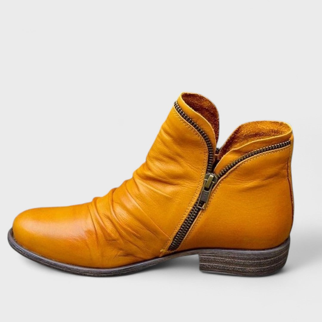 Maggie comfort boots in neutral tones with cushioned support and ergonomic slip-on design