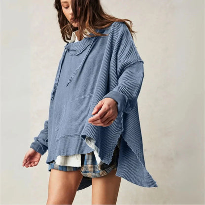 Beige oversized waffle-knit hoodie with slouchy drop shoulders and raw hem edges