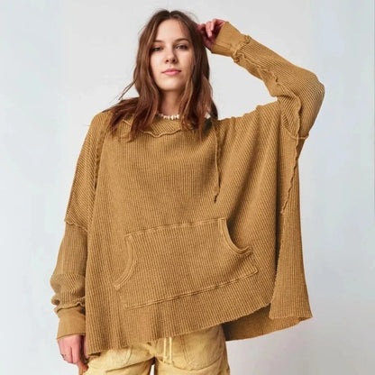 Oversized beige waffle-knit hoodie with slouchy drop shoulders and raw hem detail