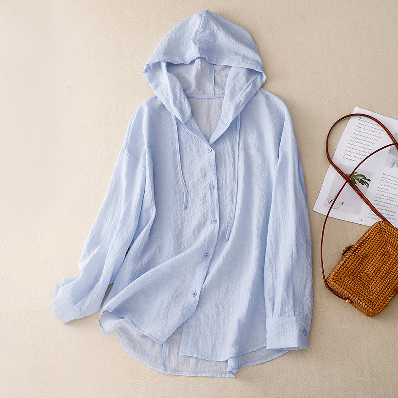 Lightweight women's hoodie with button closure, relaxed fit, soft hood, warm-weather layering essential