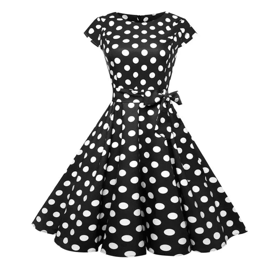 Women's navy blue 1950s fit-and-flare swing dress with cinched waist and retro vintage silhouette
