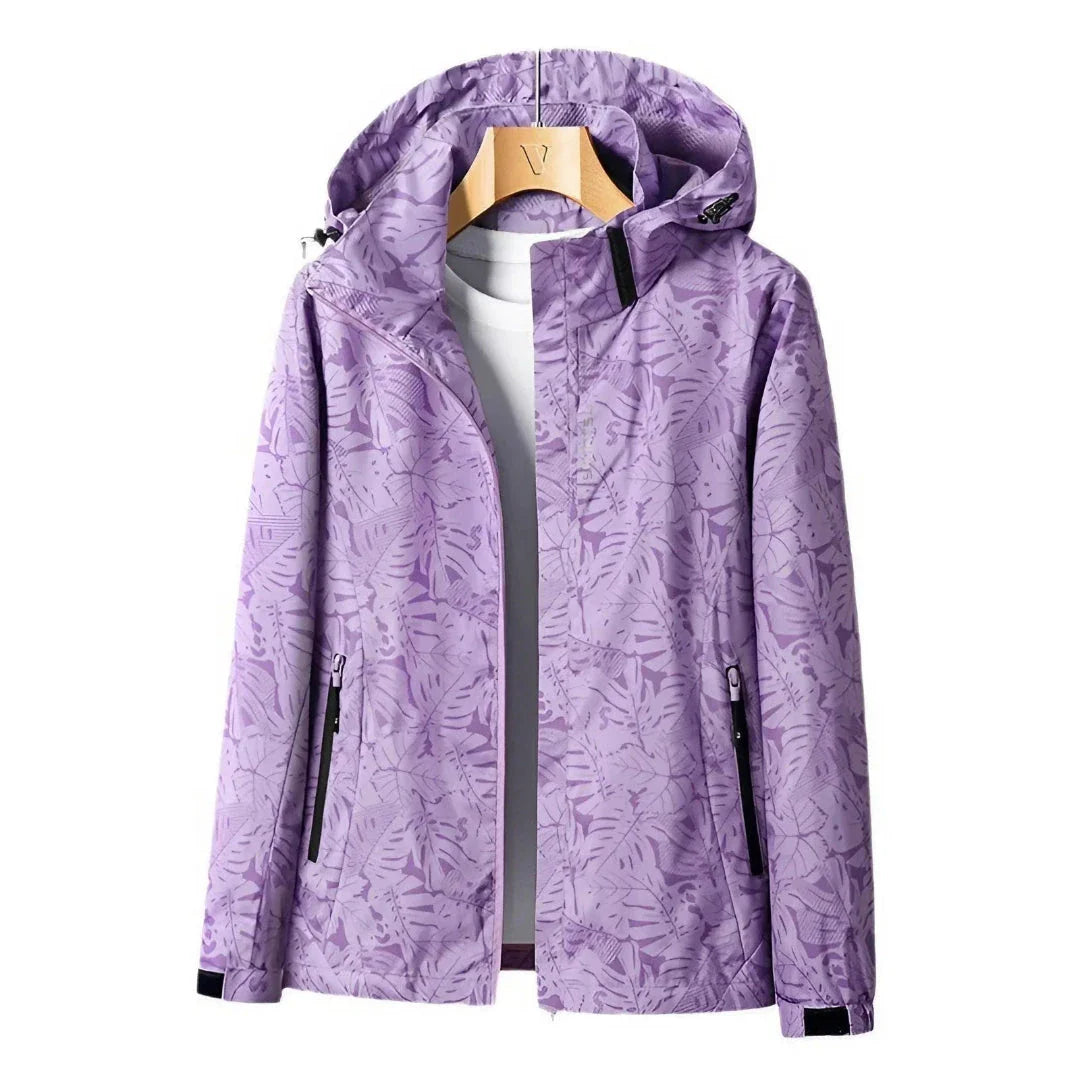 Women's lightweight waterproof jacket with adjustable hood, wind-resistant fabric, zip pockets