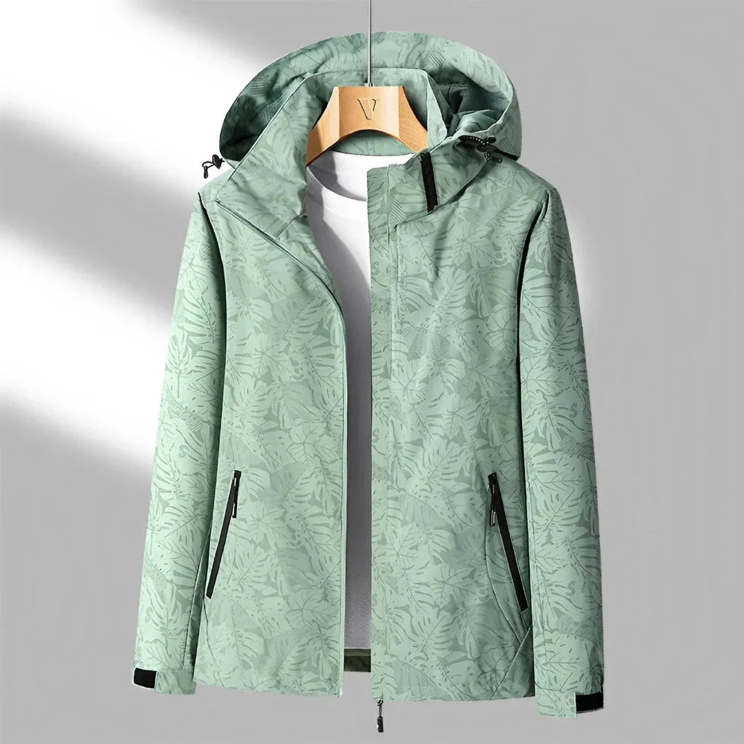 Women's lightweight waterproof jacket in neutral tone, wind-resistant with adjustable hood and zip pockets