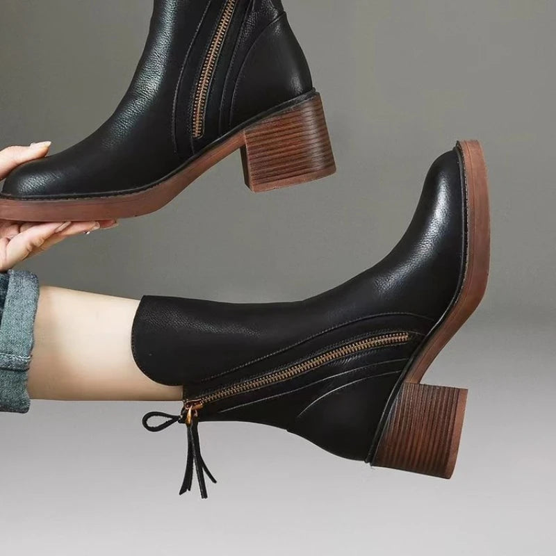 Black leather zip-up ankle boot with 2-inch block heel and cushioned insole for all-day comfort