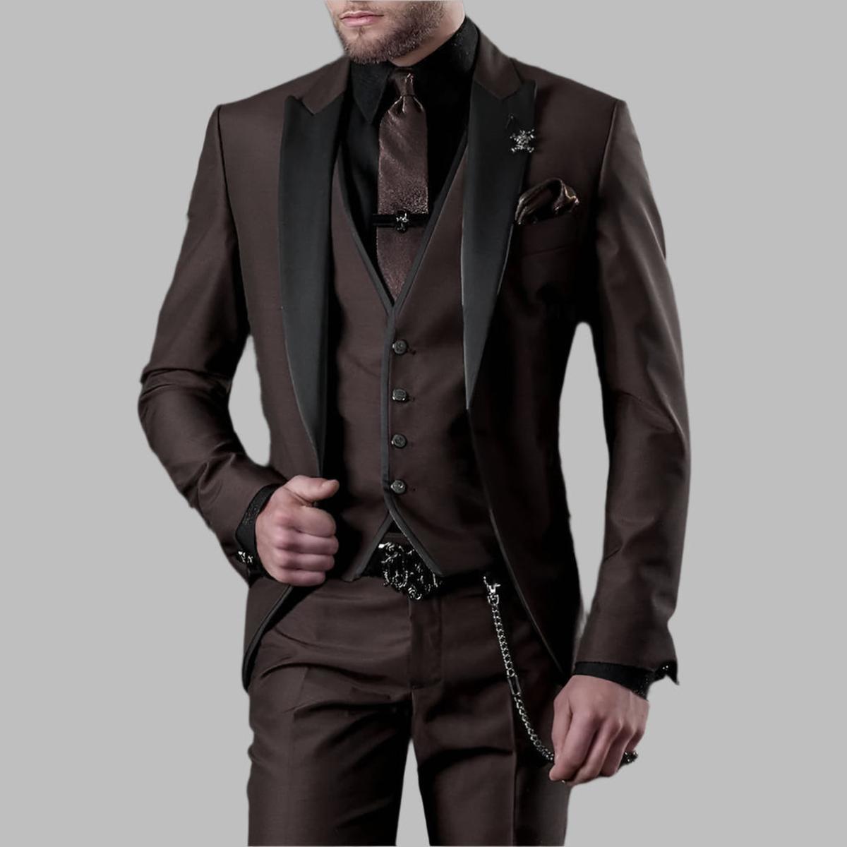 Emerald green men's three-piece wedding suit with black lapels and silver chain details