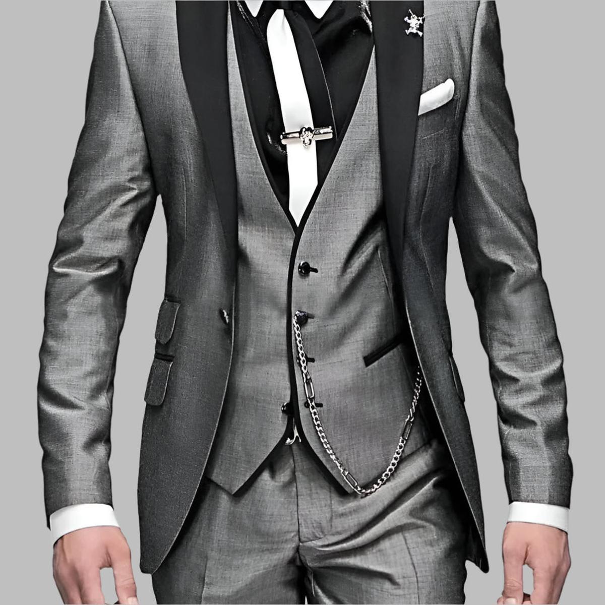 Emerald green men's three-piece wedding suit with black lapels and silver chain details