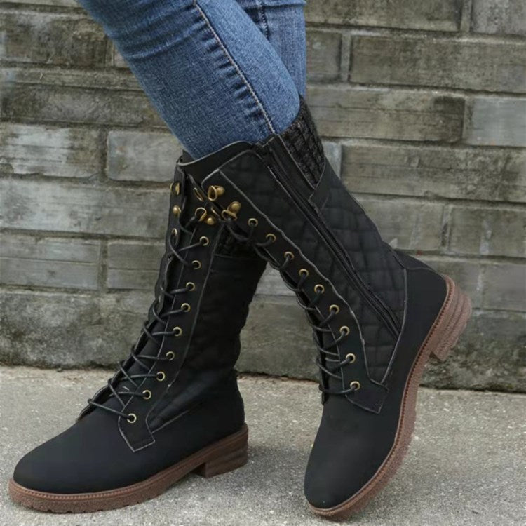 Women's mid-calf motorcycle boots in premium suede with bold moto stitching and rugged street-style silhouette