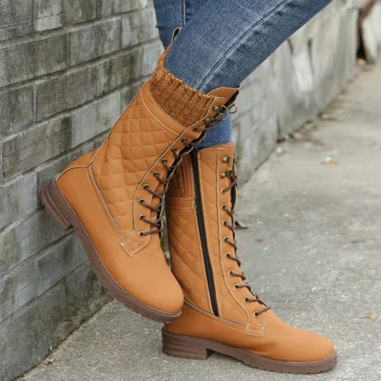 Women's mid-calf motorcycle boots in suede with moto-inspired stitching and bold street-style silhouette