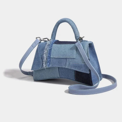 Mini structured denim patchwork handbag with raw-edge accents and detachable crossbody strap
