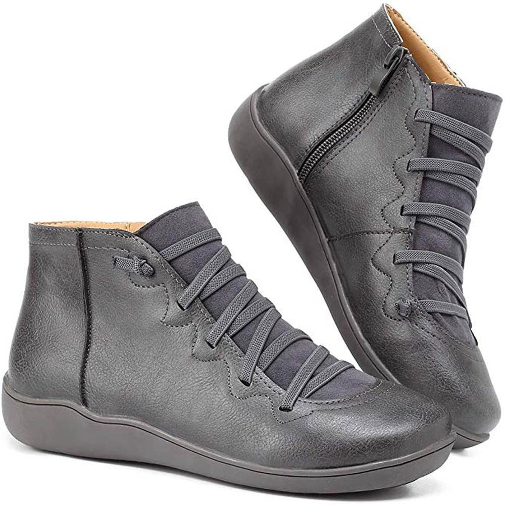 Women's black minimalist lace-up ankle boots with clean lines and sleek low-profile silhouette
