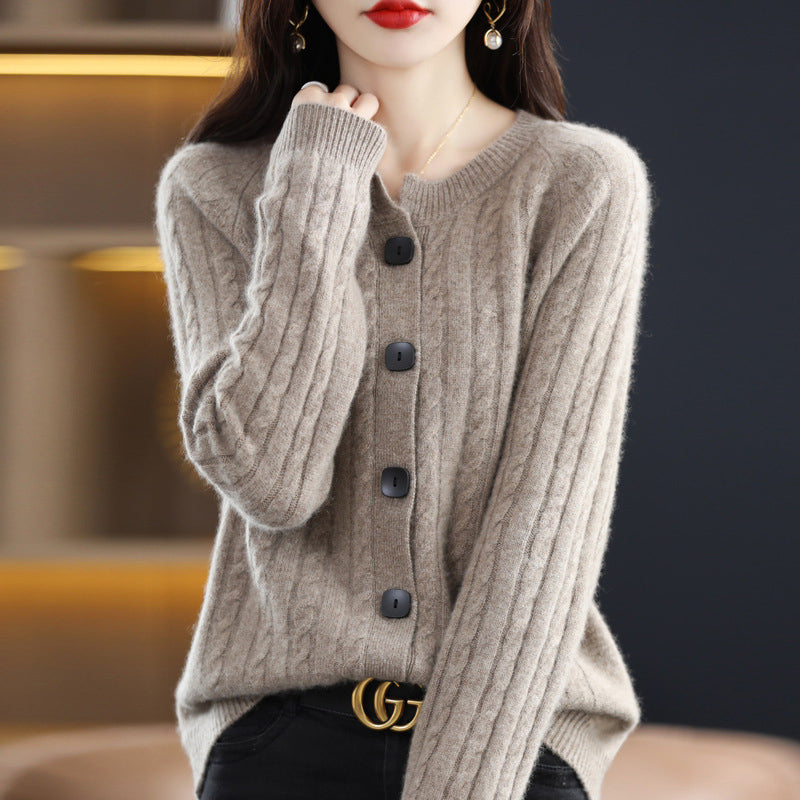 Beige minimalist cable knit cardigan with round neck, front buttons, ribbed cuffs, and clean modern silhouette