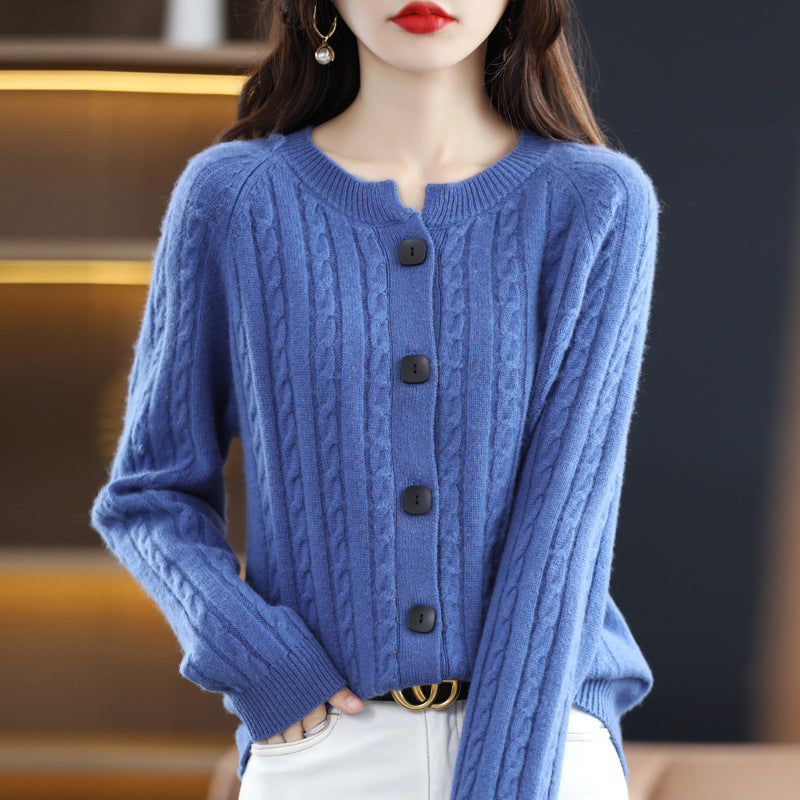 Neutral cable knit cardigan with round neck, ribbed cuffs, minimalist cut, and front button fastening