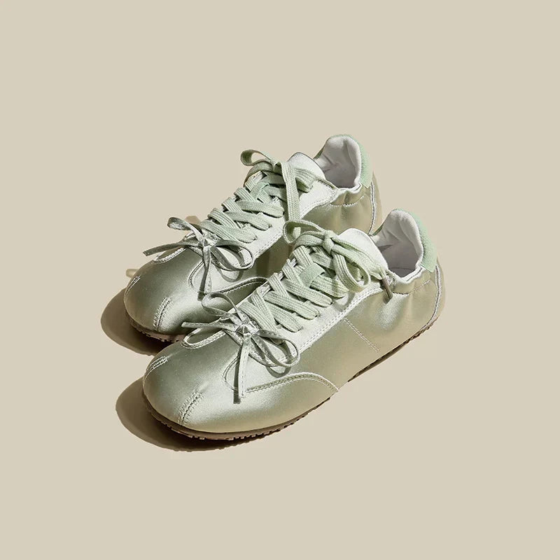 Caroline women's satin trainers in sleek finish with cushioned sole, blending luxury and everyday elegance