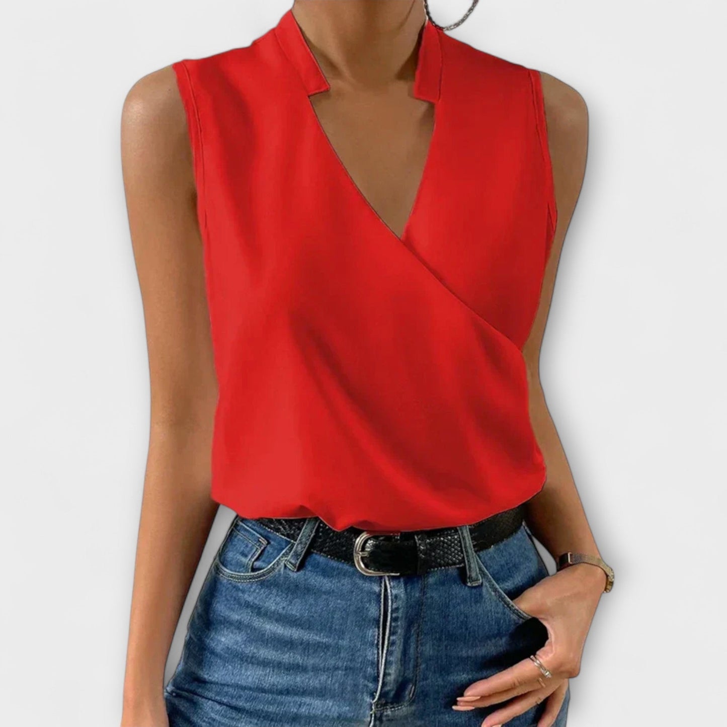 Women's sleeveless white wrap V-neck collared blouse with crossover drape and polished silhouette