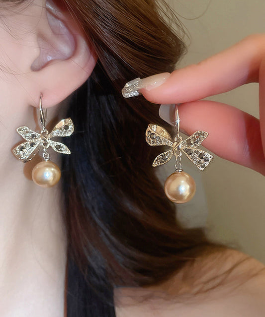 Boucles d'oreilles pendantes modernes en alliage de cuivre et zircon, avec perles et nœud en forme de nœud, couleur champagne - Wavlynn