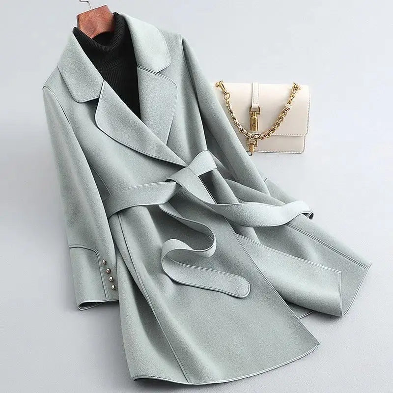 Slim fit mid-length women's wool blend winter coat with sleek clean lines and cozy chic silhouette
