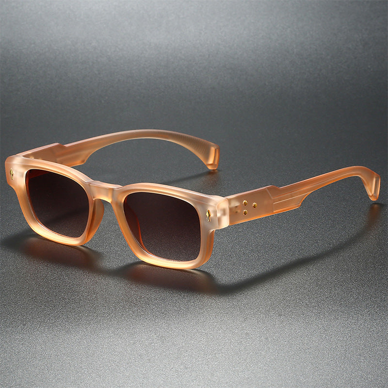 Matte black square sunglasses with thick temple arms and bold stud details for everyday style