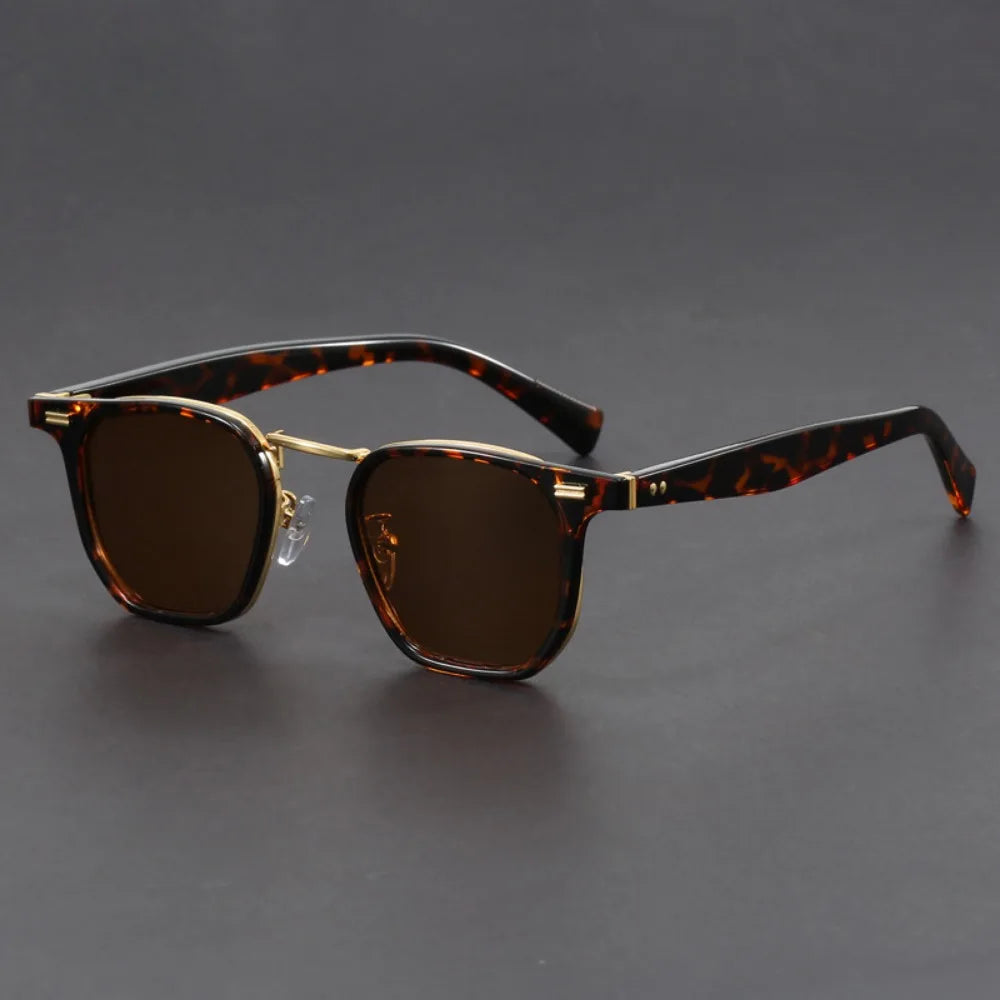 Black square acetate sunglasses with metal accents, dark lenses, UV protection, and adjustable nose pads