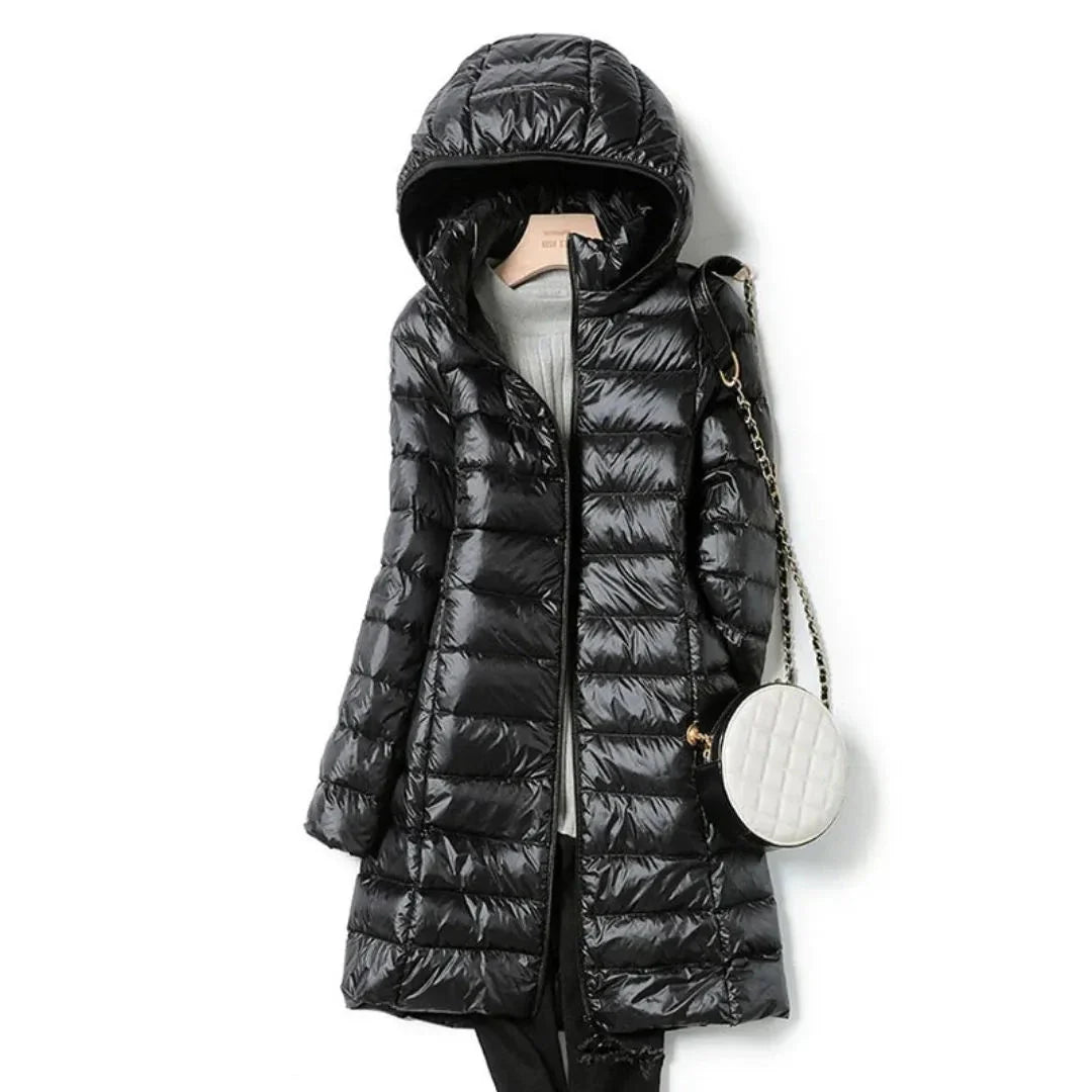 Women's black longline hooded puffer coat with quilted finish and full zip closure