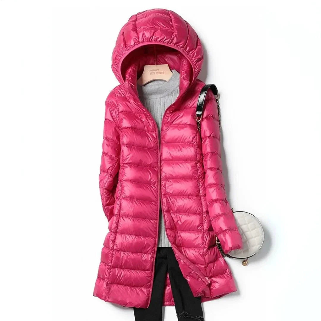 Women's black longline hooded puffer coat with quilted finish and full front zipper closure