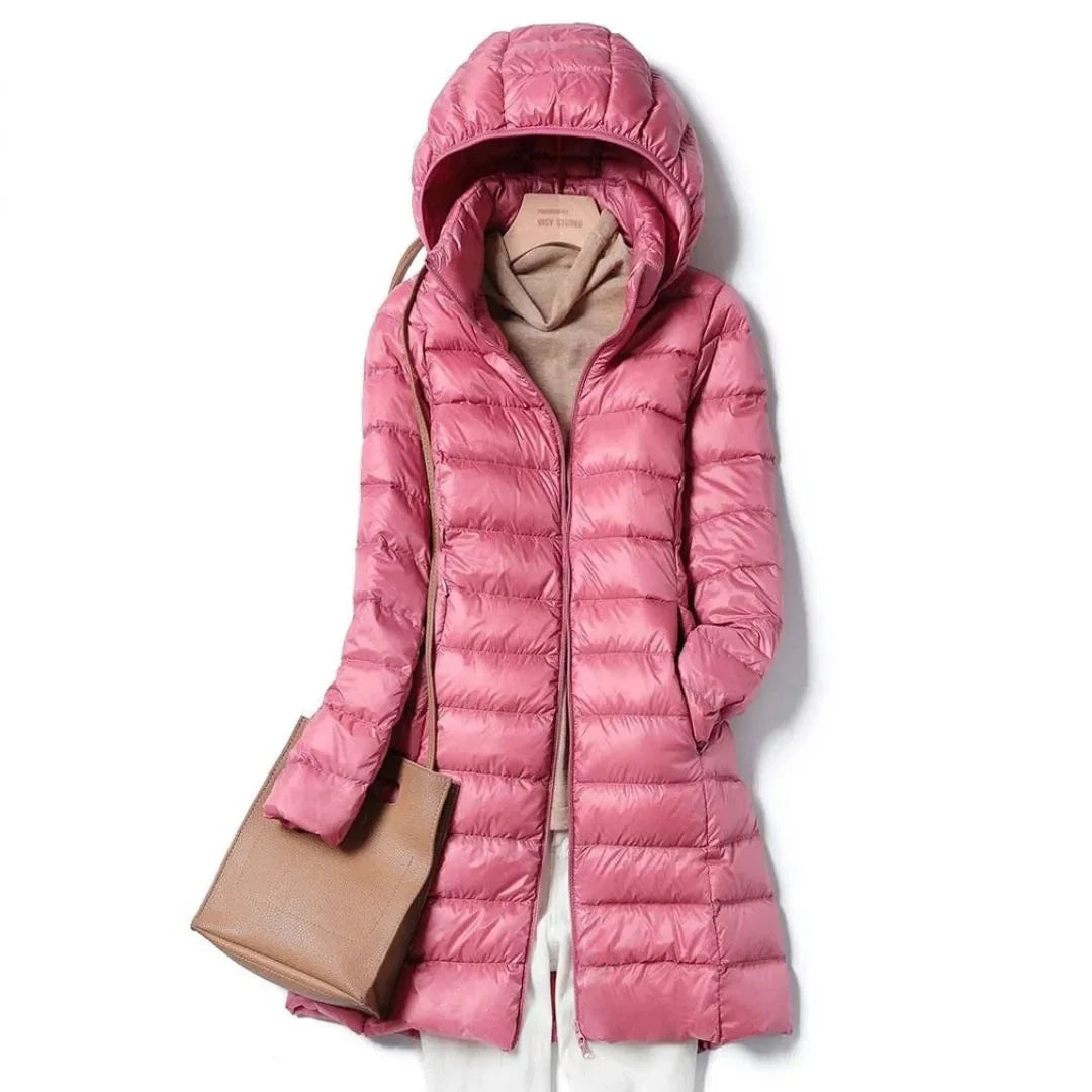 Women's black longline hooded puffer coat with sleek quilted finish and wind-resistant design