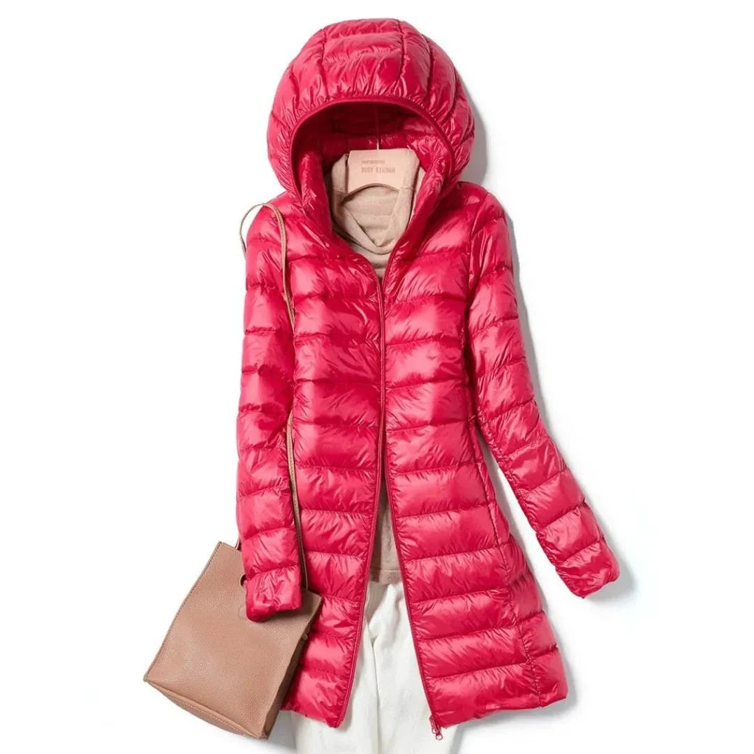 Women's black longline hooded puffer coat with sleek quilted finish and wind-resistant design