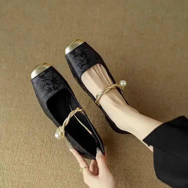 Beige brocade block heel pumps with floral pattern, pearl-button strap and metallic toe cap