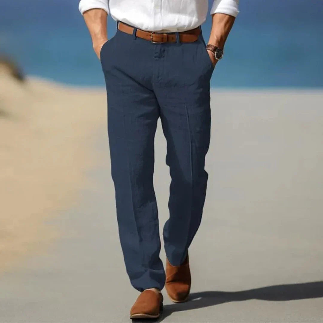 Men's lightweight linen tailored pants in neutral tone, relaxed fit with structured silhouette for resort wear