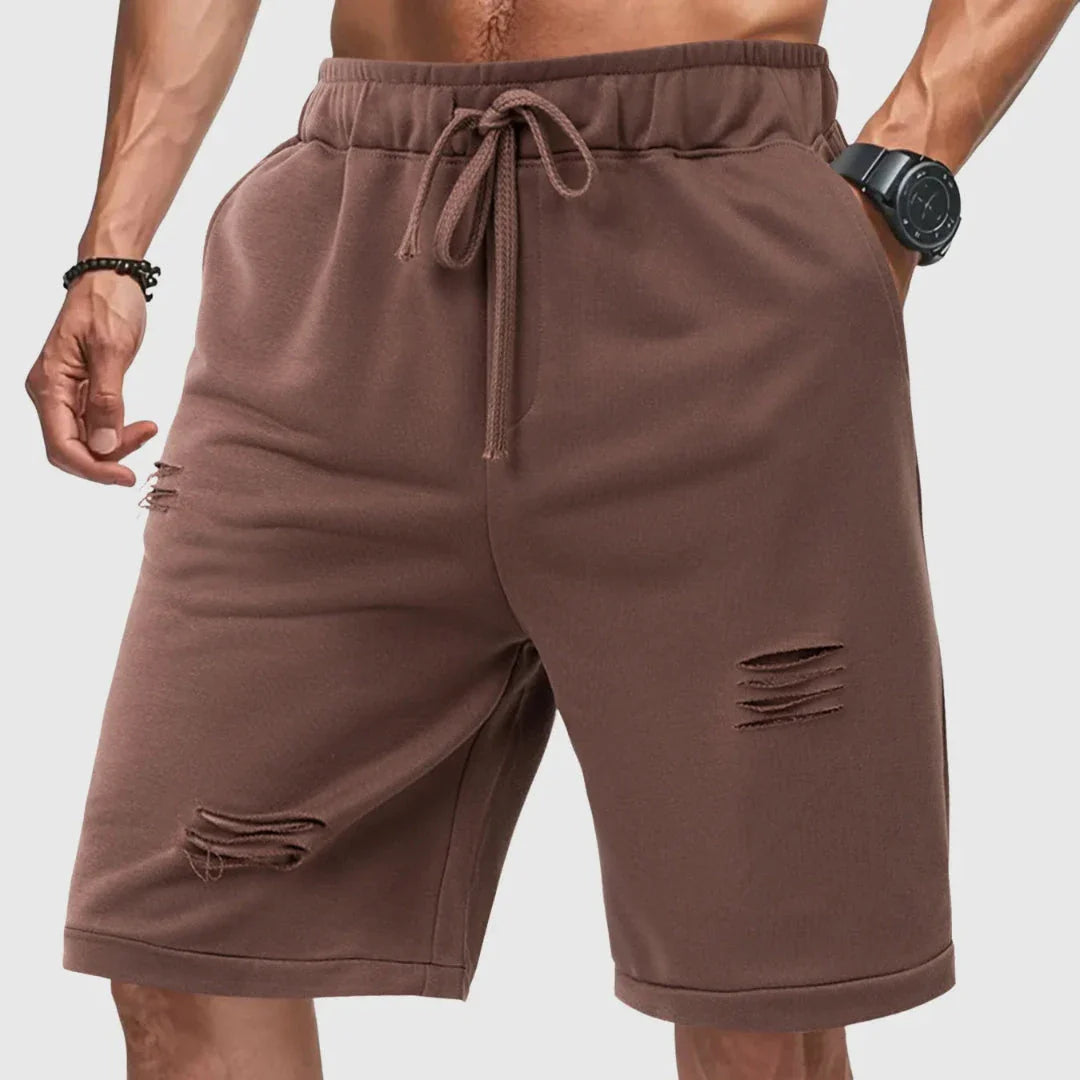 Men's grey distressed jogger shorts relaxed fit with drawstring waist and ripped detailing