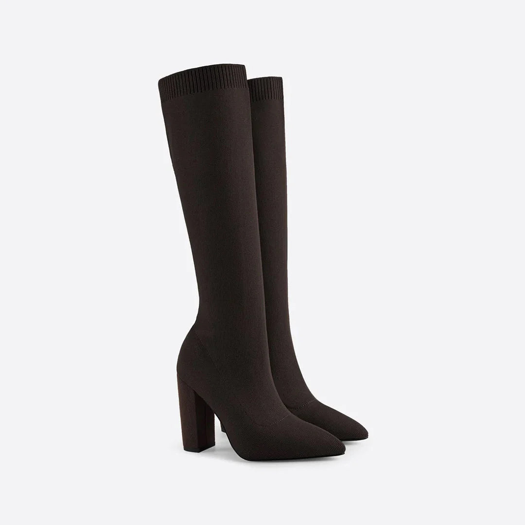 Women's black knee-high heeled winter boots with sleek form-fitting shaft for elegant cold-weather style