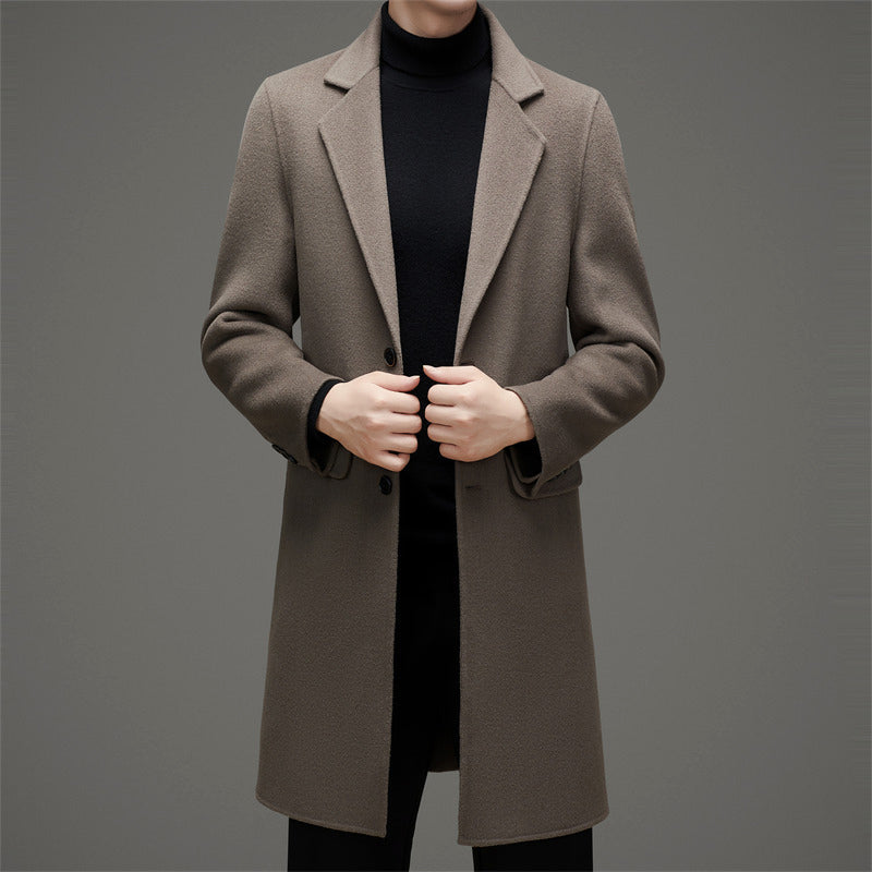 Tailored slim wool blend overcoat in neutral tone with sculpted peak lapels and two-button closure